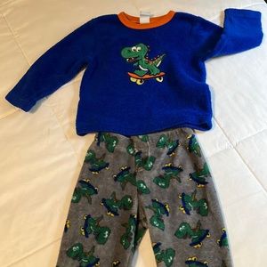 Cute, cozy skateboarding dinosaur pajama set